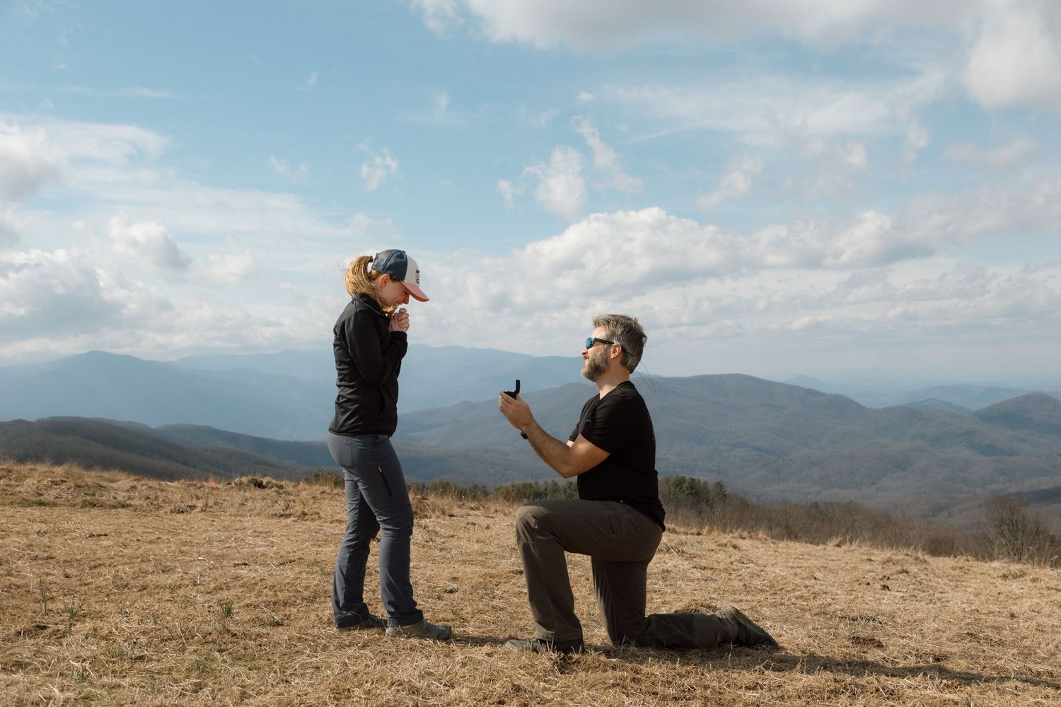 unique couple proposing at blue ridge mountain overlook near Asheville, North Carolina
