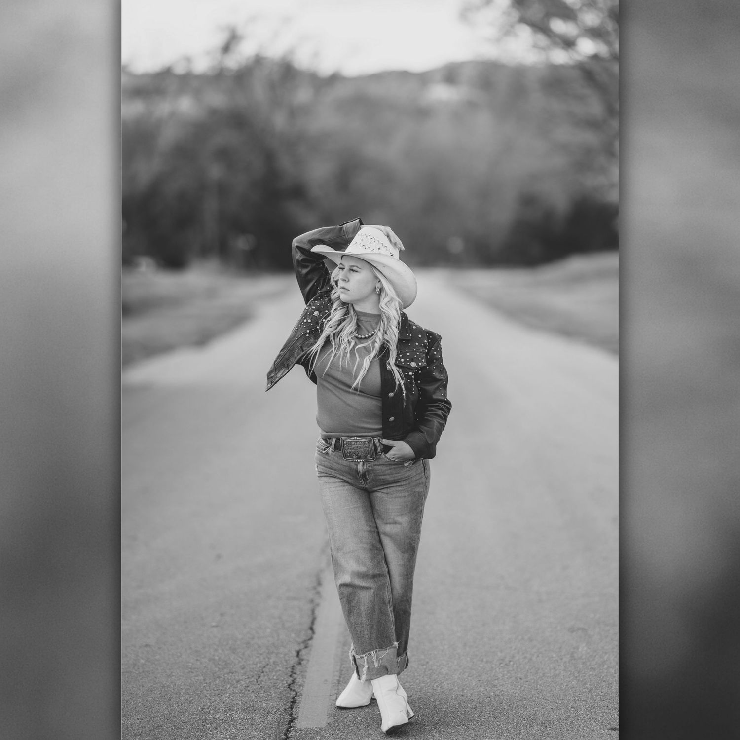 Black and white photo sequence showing a couple embracing and dancing together on a rural road.