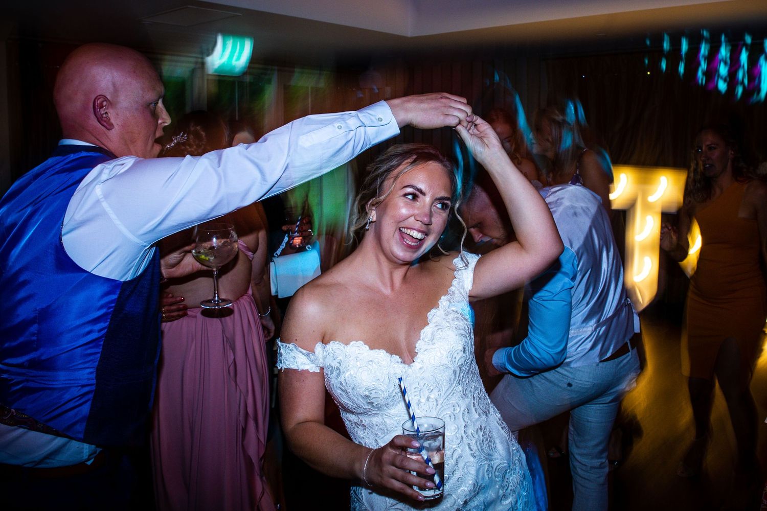 Kelham House wedding photograph of the Garden Room at night filled with guests dancing and celebrating