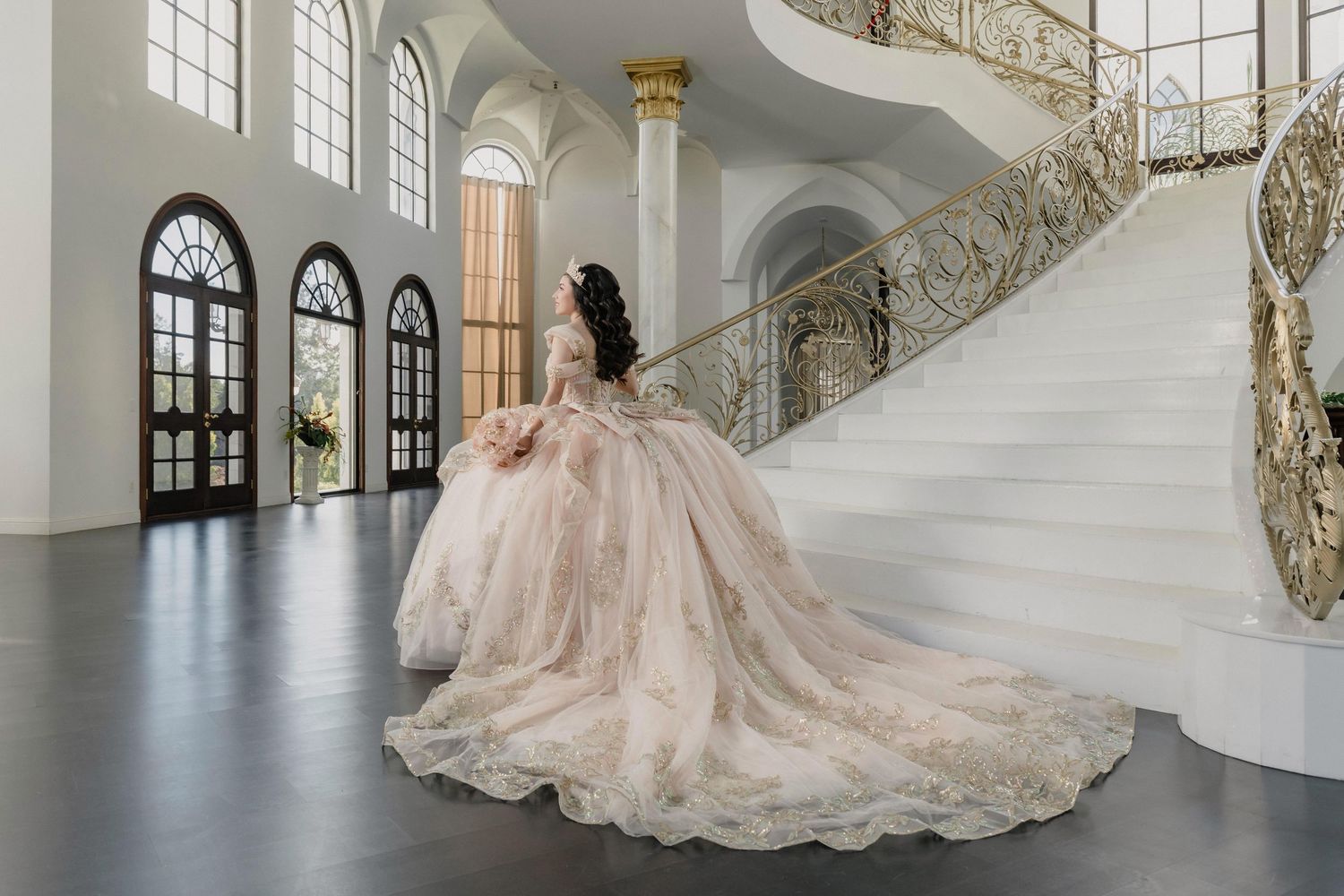A stunning quinceanera in beautiful pale pink dress for a lovely and elegant White Swan Castle quince session