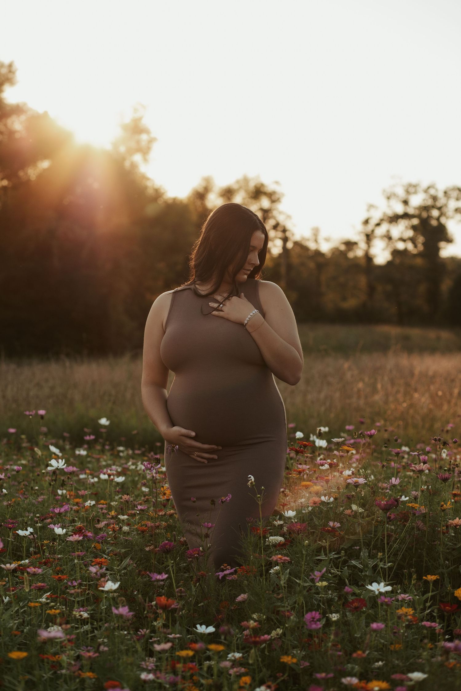 maternity photo at sunset in flowers