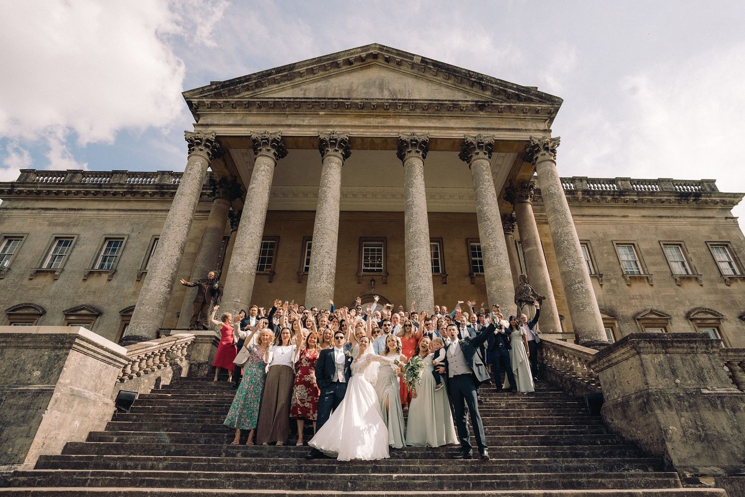 Large wedding party gathered on the grand stone steps with Nova Scotia wedding photographer Alicia Victoria