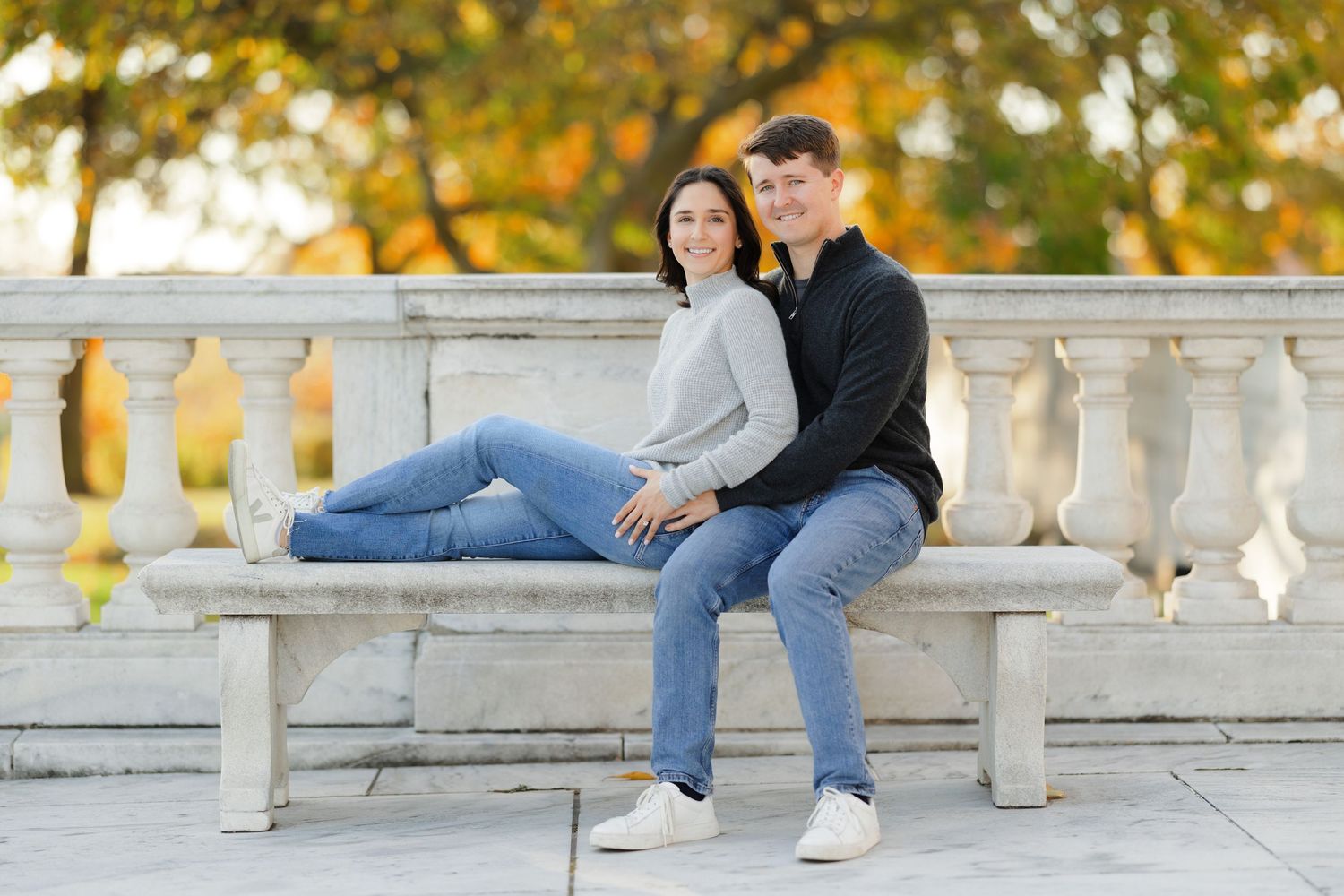 Portrait of happy engaged couple on fall day outside Cleveland Museum of Art photographed by Tom Forrest from Hudson, Ohio.