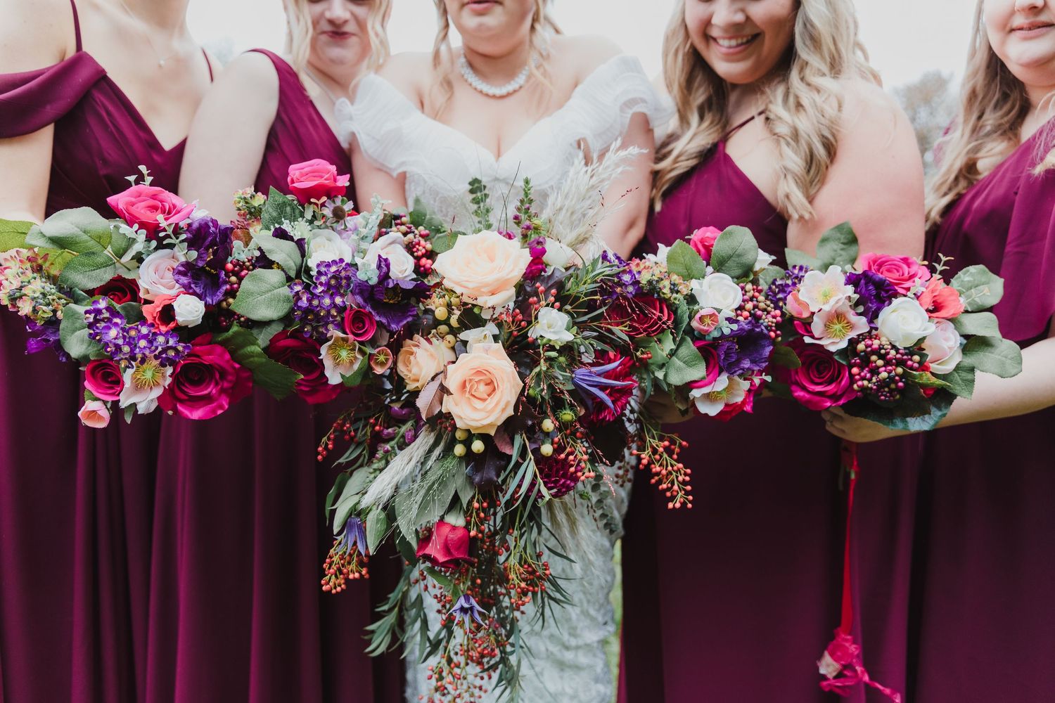 Bridesmaids holding vibrant purple and pink floral bouquets with greenery. Photographer. Hull. East Yorkshire. Photography