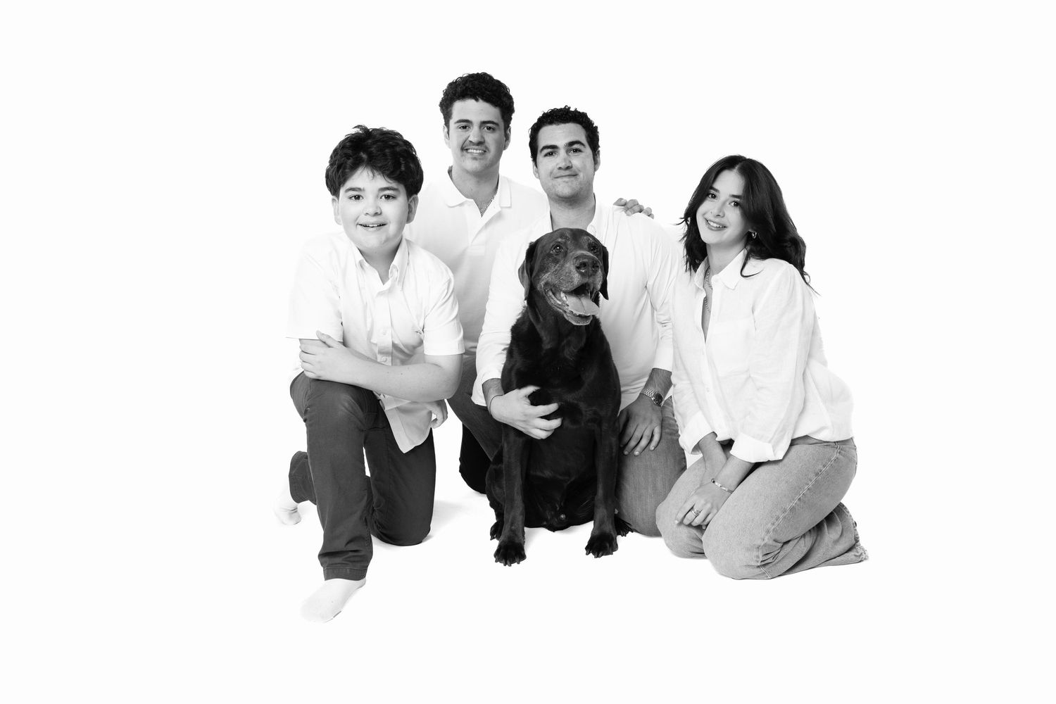 A series of black and white family portrait photos arranged in a horizontal row showing different poses and groupings.