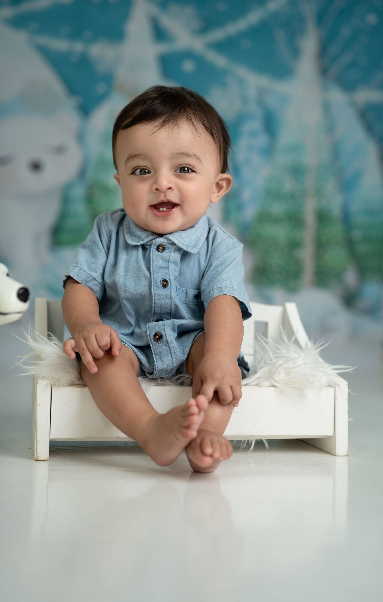 Cake smash photoshoot Dubai baby enjoying splash bath after cake smash session in a professional photography studio Dubai