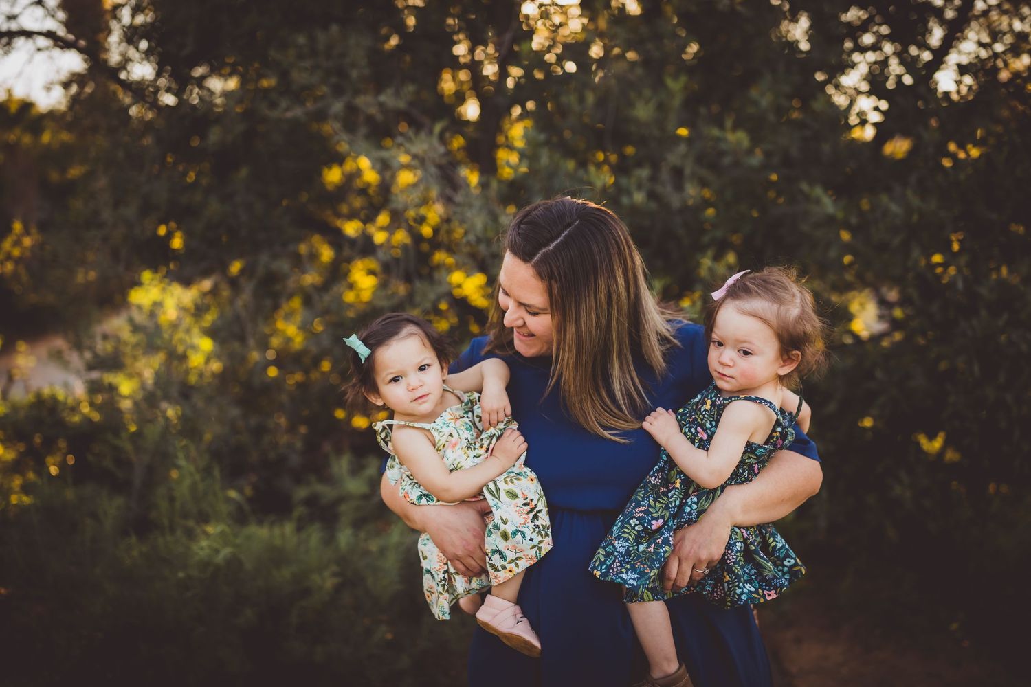 A series of outdoor family portraits in a garden setting with warm golden sunlight filtering through trees.