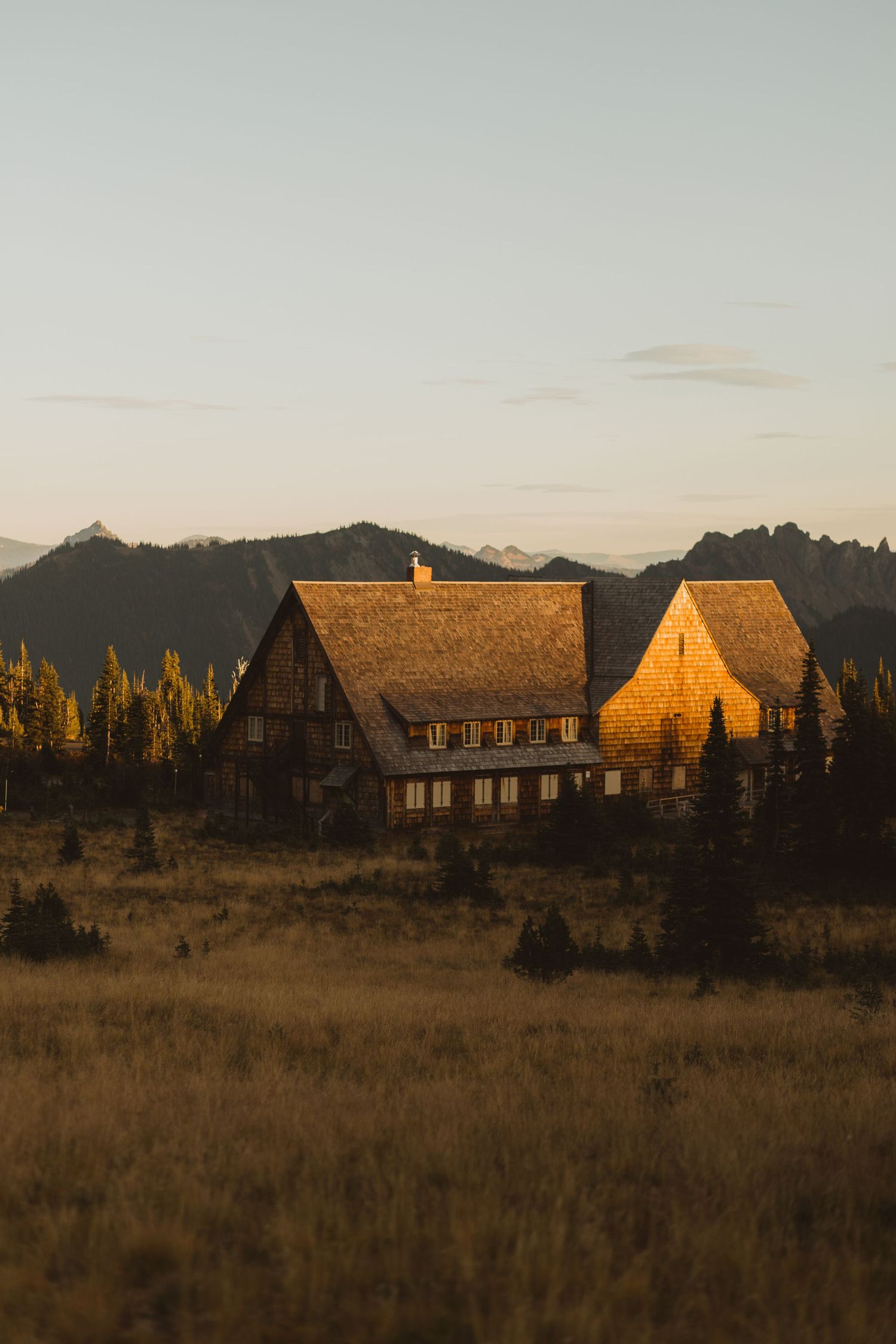 Rustic golden-hour photo of the Paradise Inn also known as the Henry M. Jackson Visitor Center at Paradise from a golden hour elopement