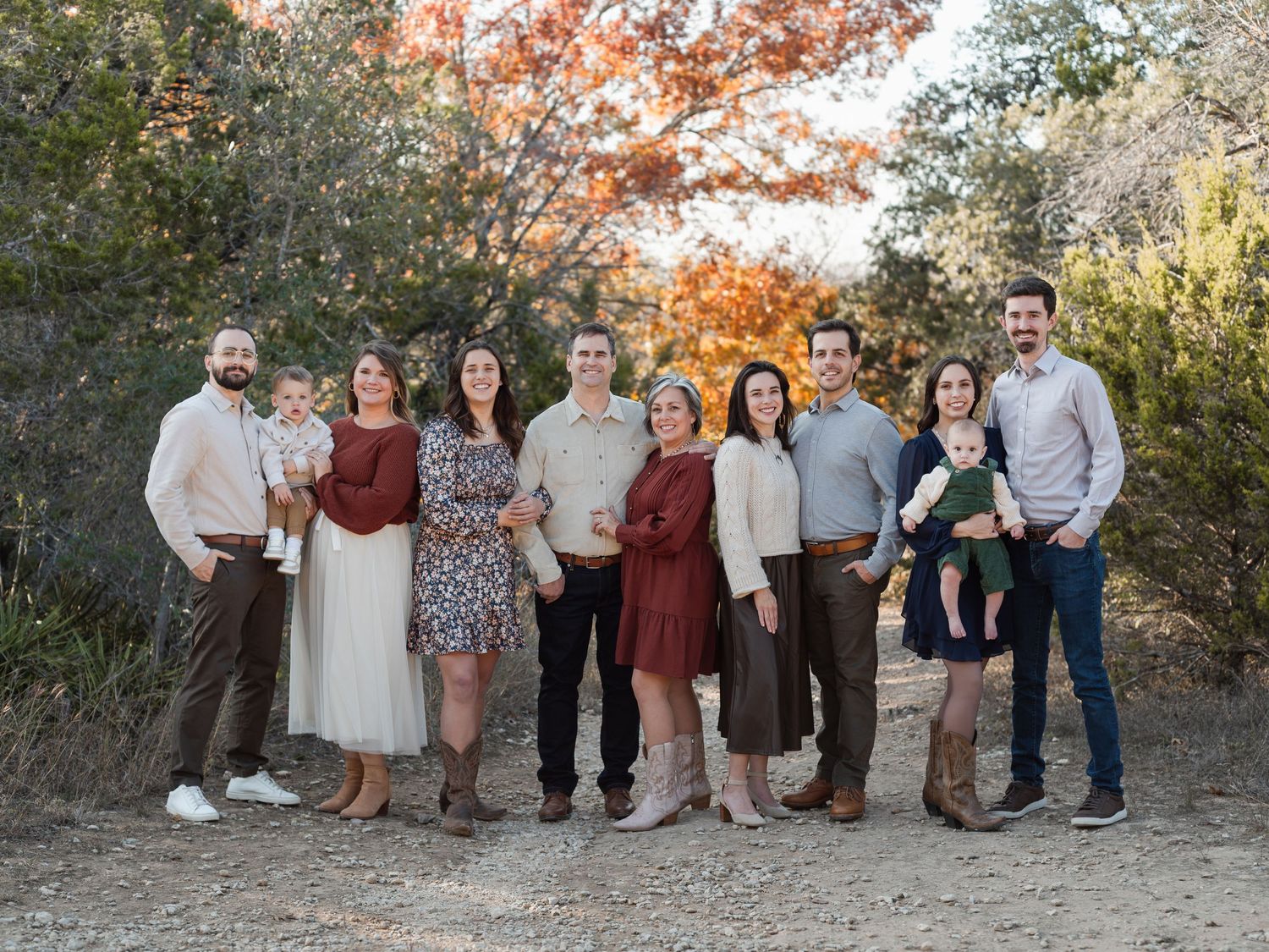 Large extended family posing together at McKinney Falls State Park in Texas