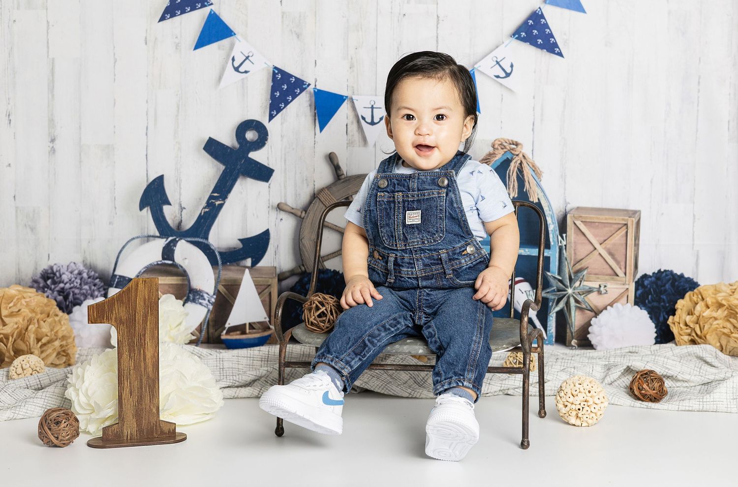studio cake smash photo of a cute little girl