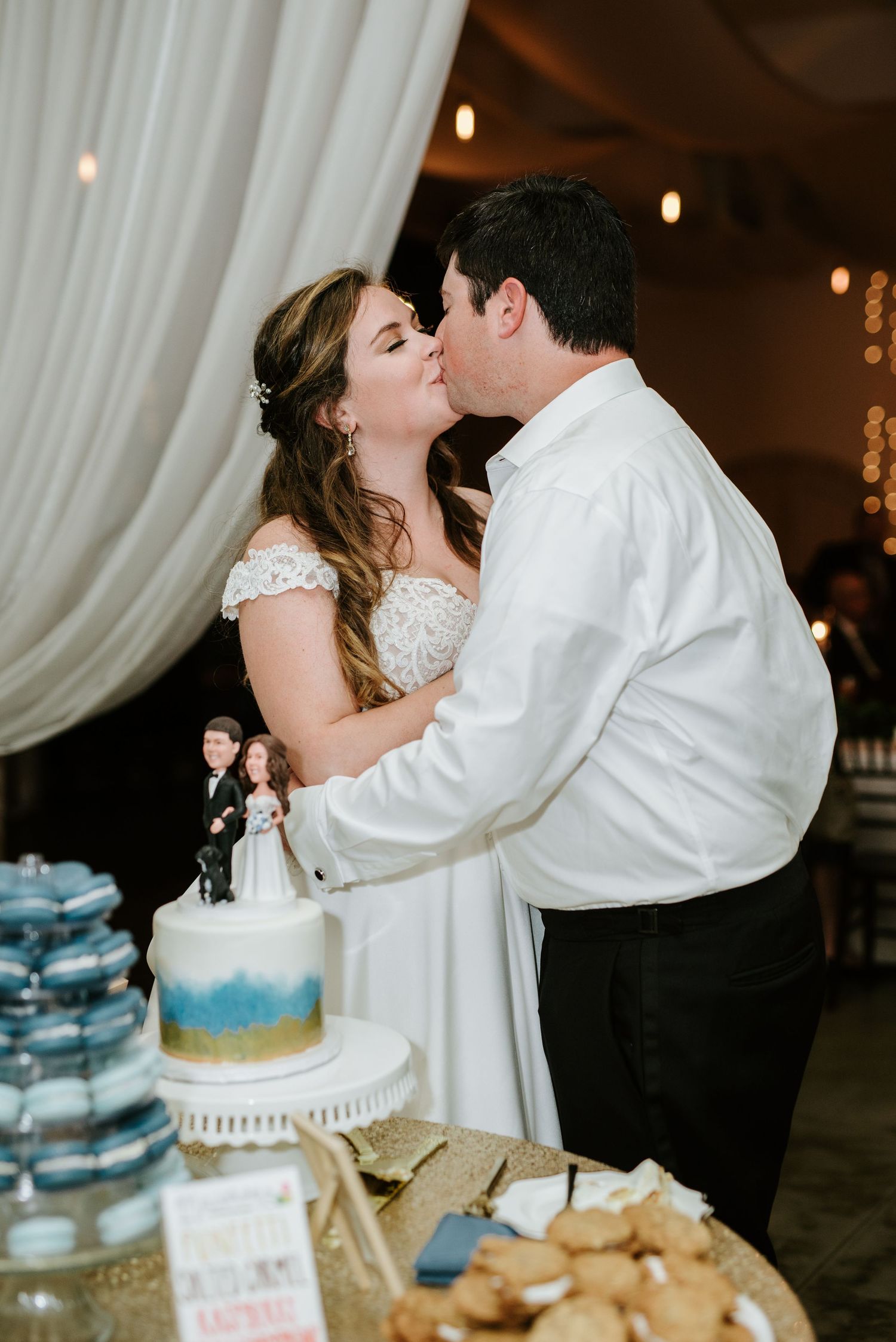 A romantic wedding cake cutting moment captured in a sequence of photos showing the couple sharing a sweet kiss.