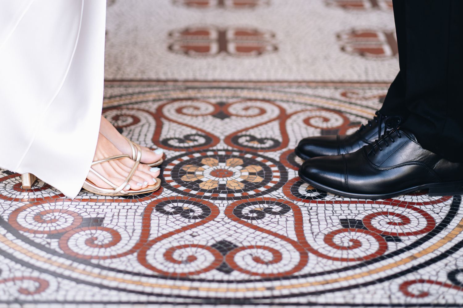 Close-up view of bride and groom's formal shoes and heels taken during their registration of marriage taken by a Melbourne photographer