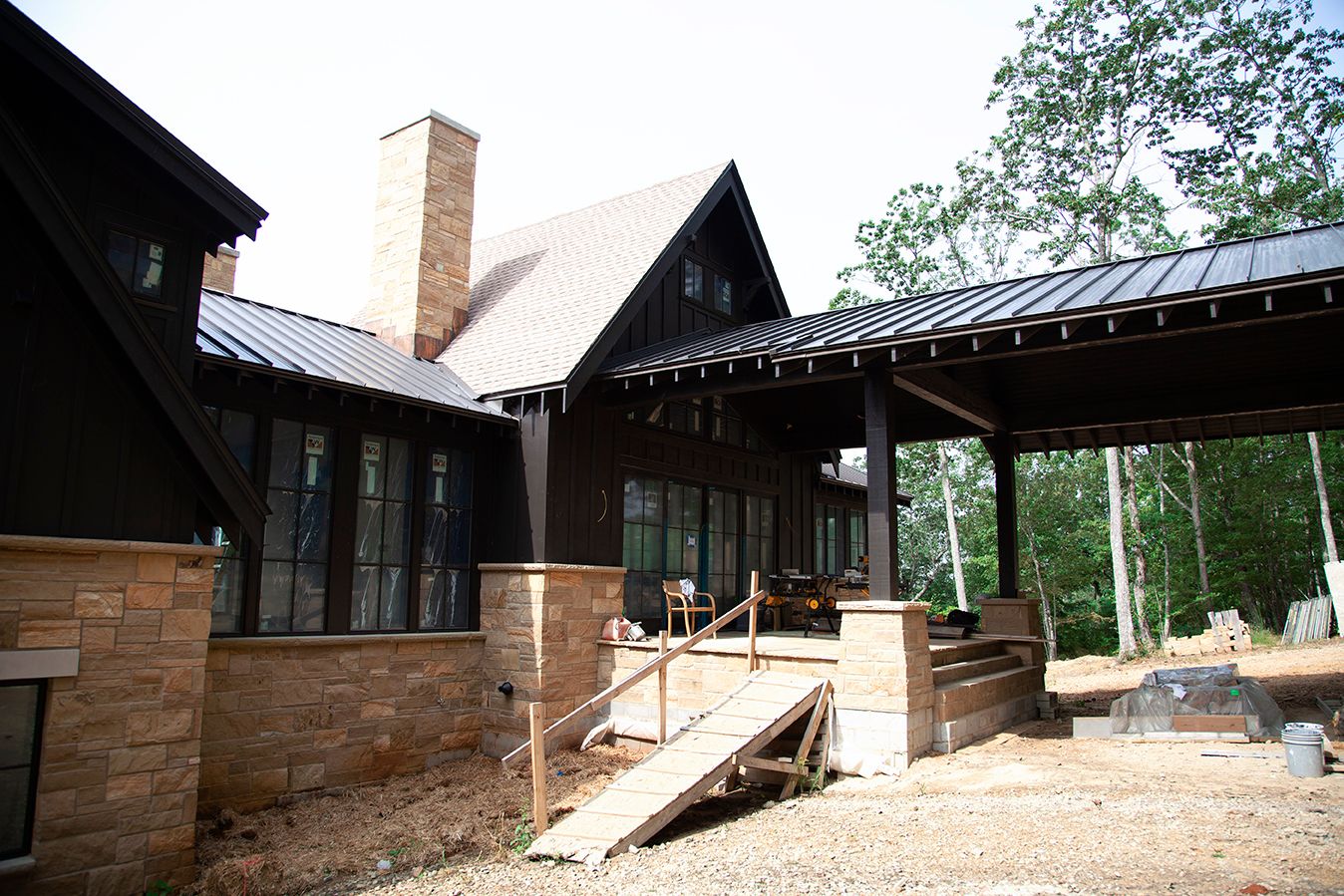 Modern wooden architectural exterior with multiple connected building structures.