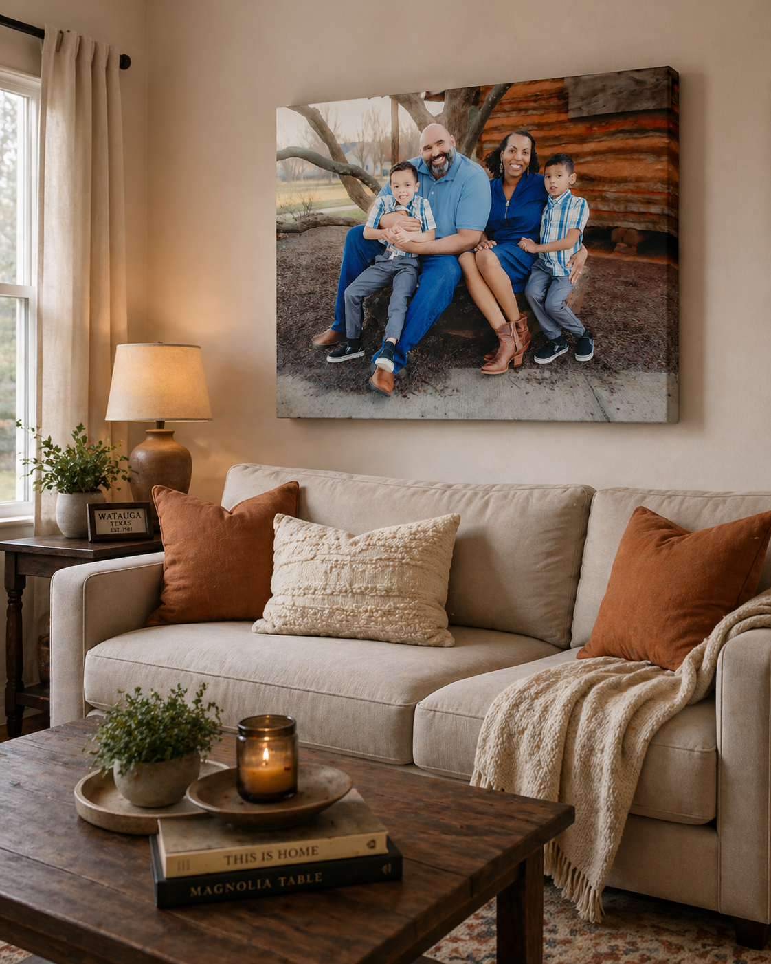 Family of four smiling on canvas wall art displayed above a beige sofa in a cozy neutral-toned living room in Watauga, TX.
