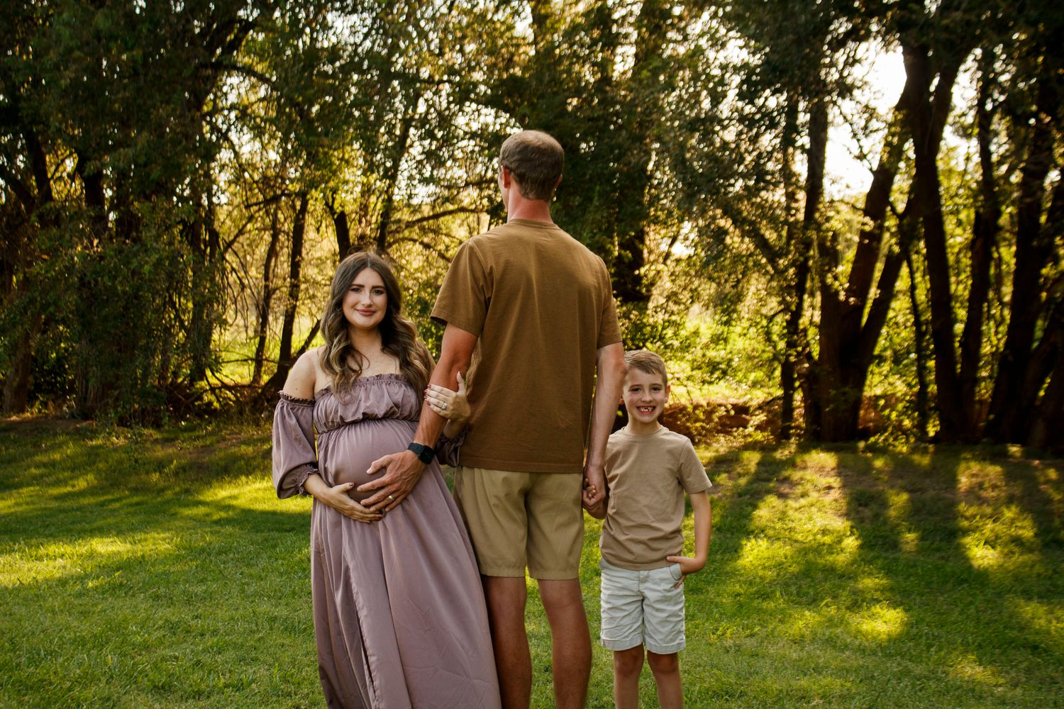 A family of three during a maternity photo session at The League House in Amarillo, Texas.