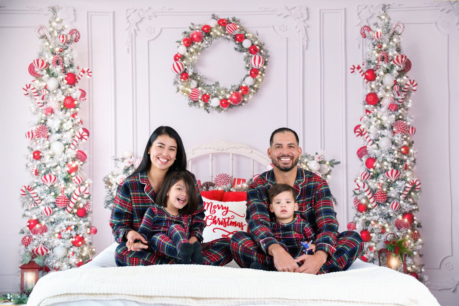 Family in peppermint Christmas pajamas Midland TX Christmas minis peppermit christmas minis photographers midland tx holiday family photos