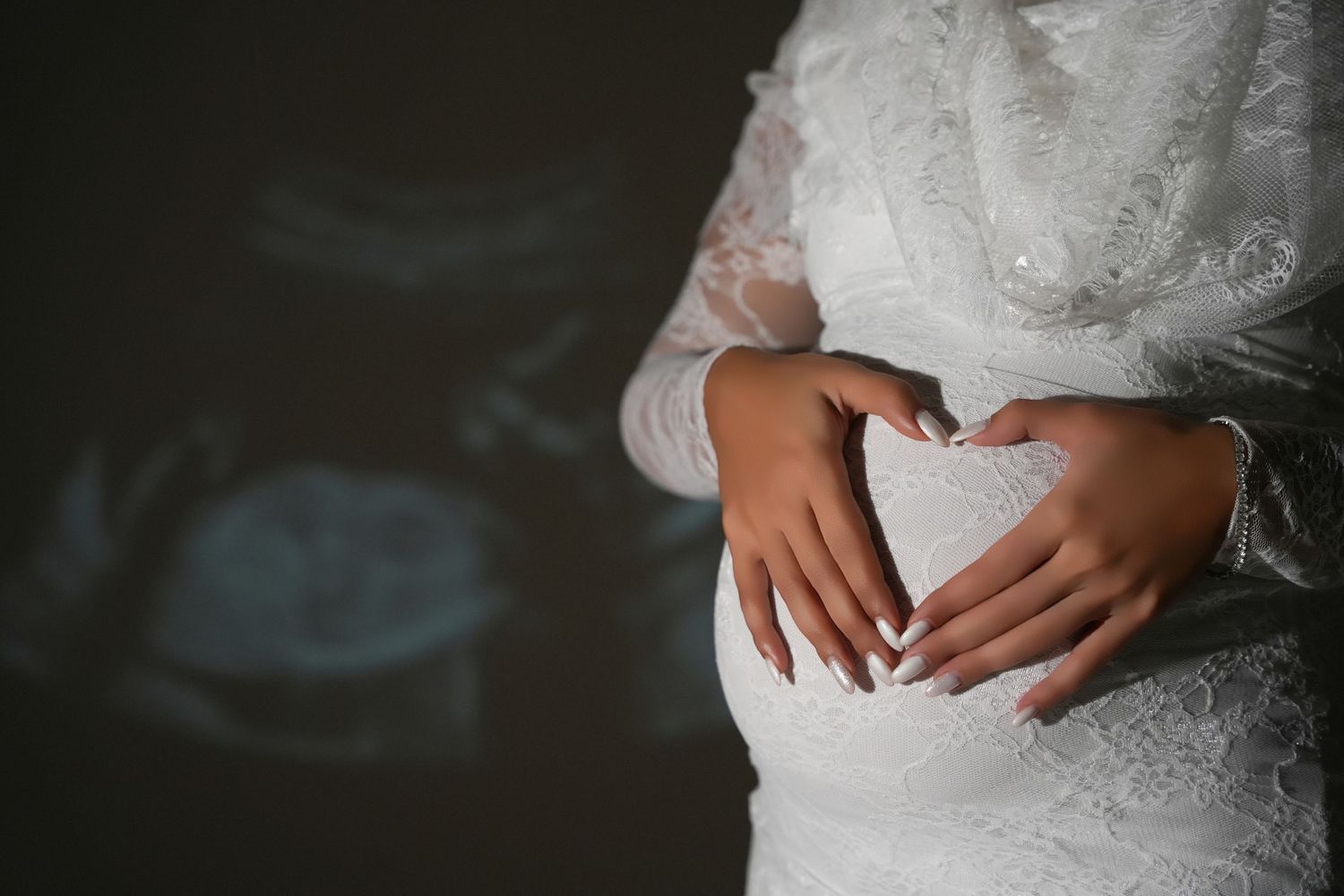 Close-up of expecting mother photographed by maternity photographer in Dubai