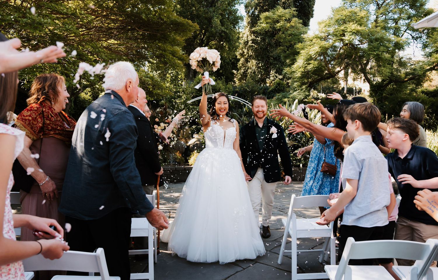 A series of candid wedding reception moments showing dancing and celebration on an outdoor patio.