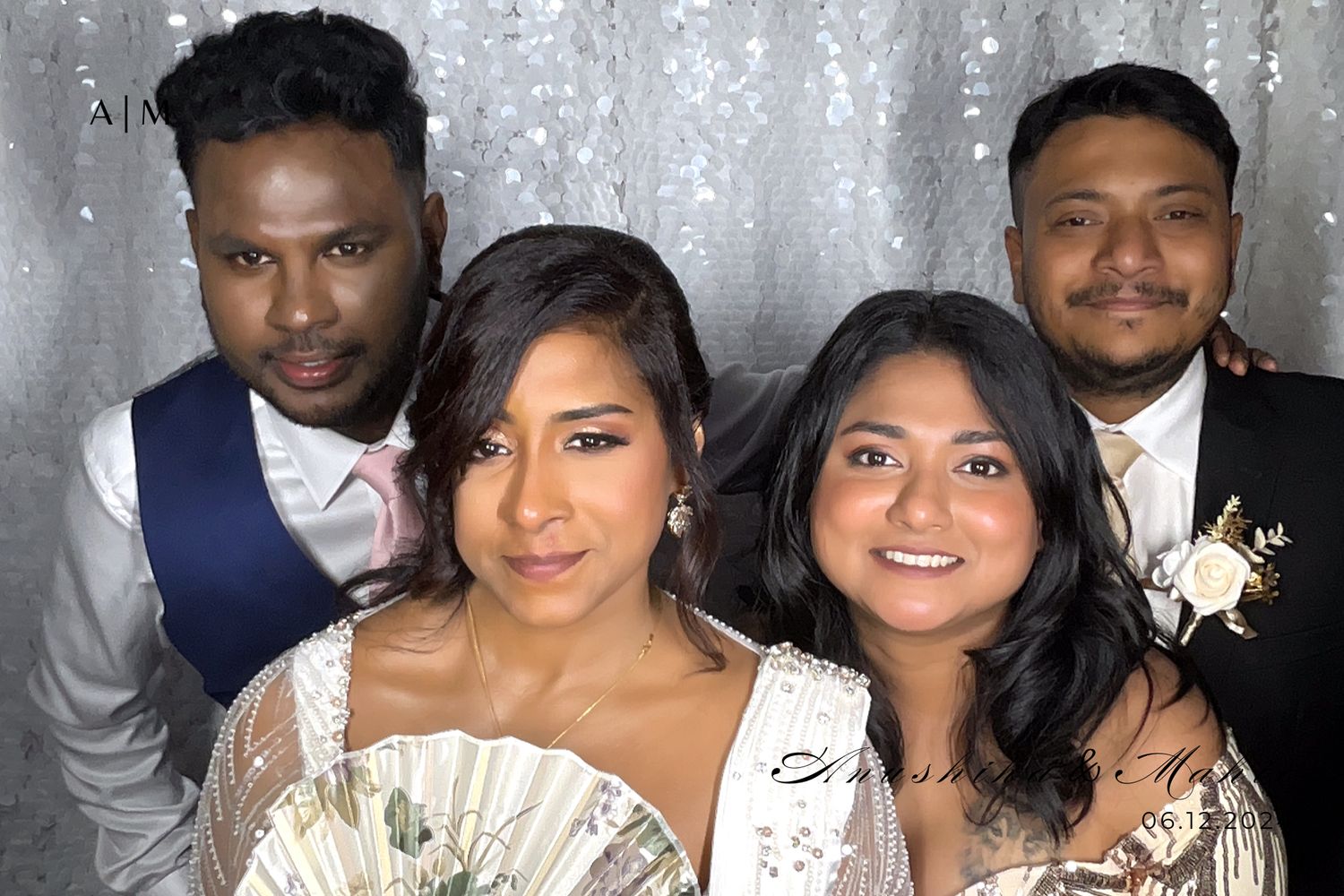 A black and white panoramic photo showing multiple guests at a formal event or celebration posing together.