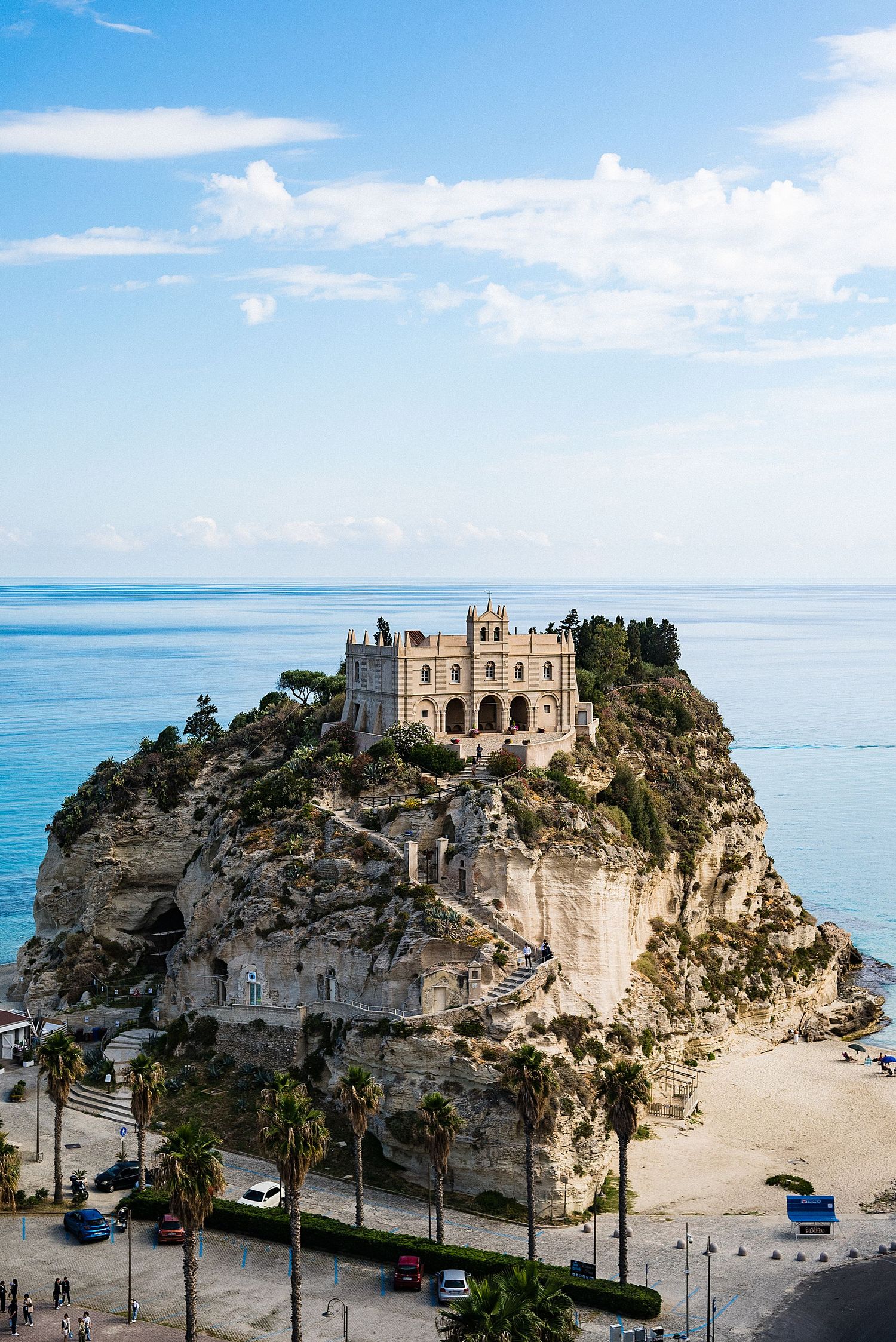 Church of Santa Maria dell'Isola perched dramatically on coastal cliff in Tropea, Italy.