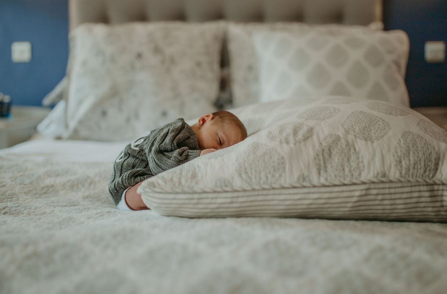 Newborn resting peacefully in their home nursery during a relaxed photography session in South East London