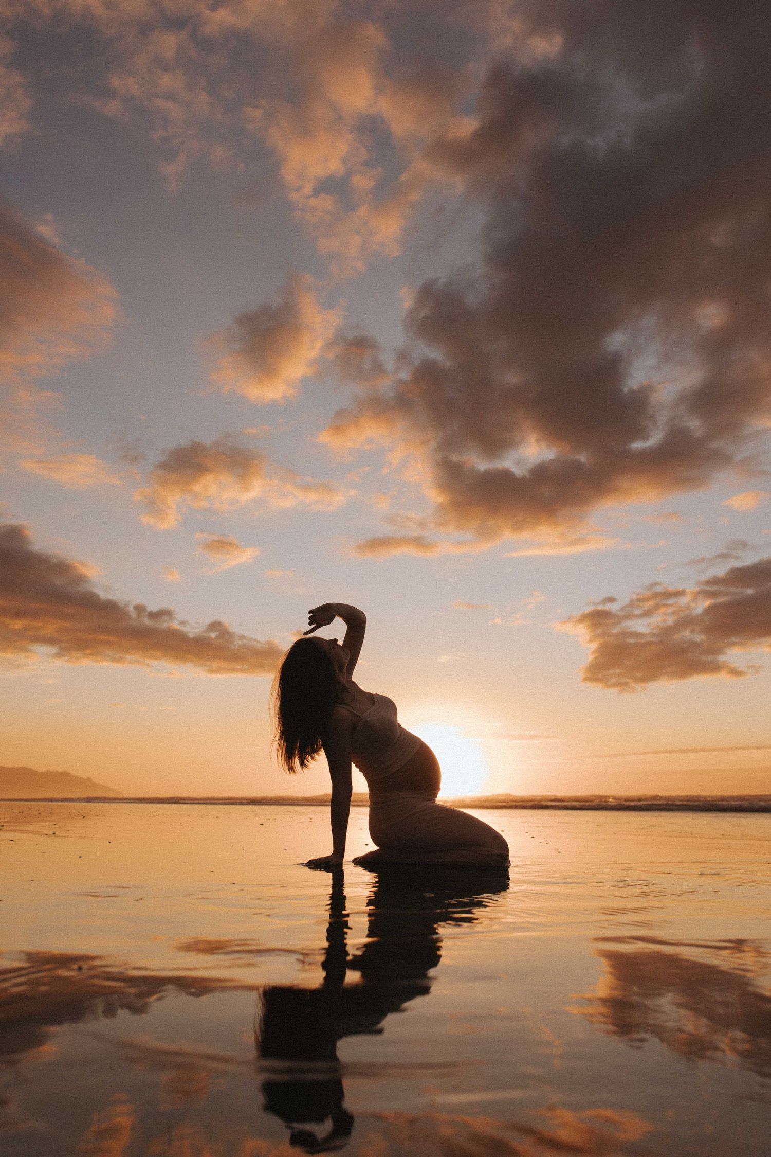 Charlotte, a pregnant photographer from Auckland, during her maternity session in Raglan, New Zealand