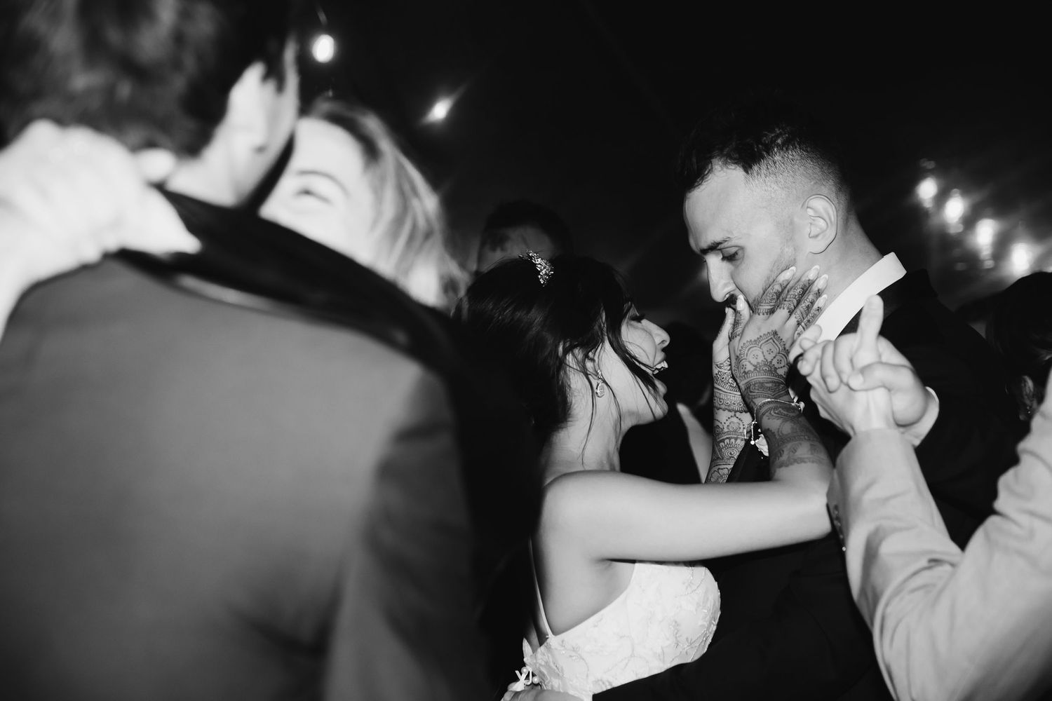 Black and white collage of wedding photos with photographer TM Channon bio text overlay.