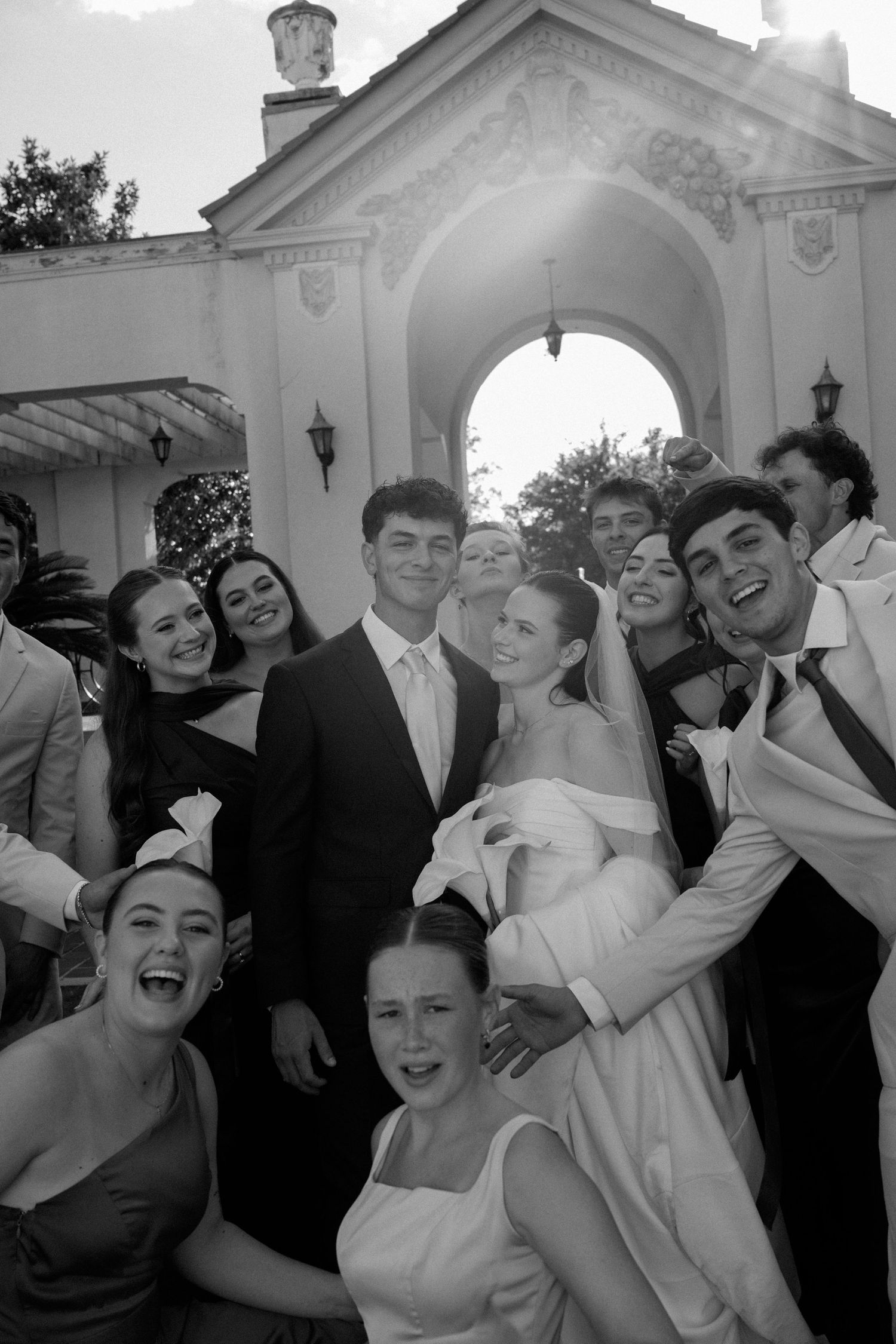 Gainesville wedding photo of couple surrounded by wedding party at the Thomas Center taken by Brooklyn Focus Photography