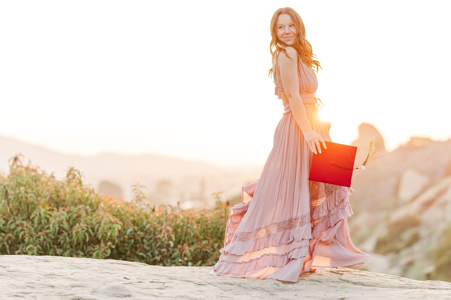 A graduation photo at Corriganville Park in Simi Valley at sunset.