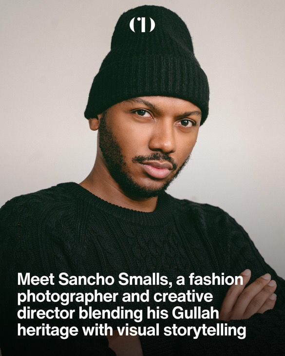 Creative portrait of a photographer wearing a black knit beanie and sweater.