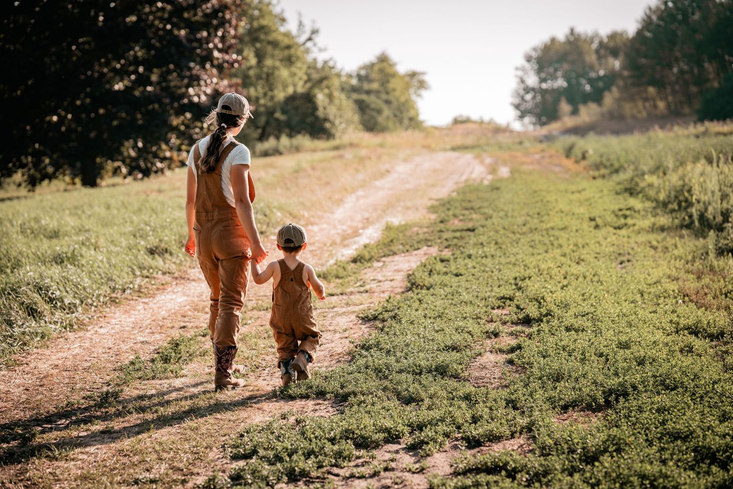 Single mother sharing a quiet moment with her two year old son during an outdoor birthday session on her family farm in Mount Albert.
