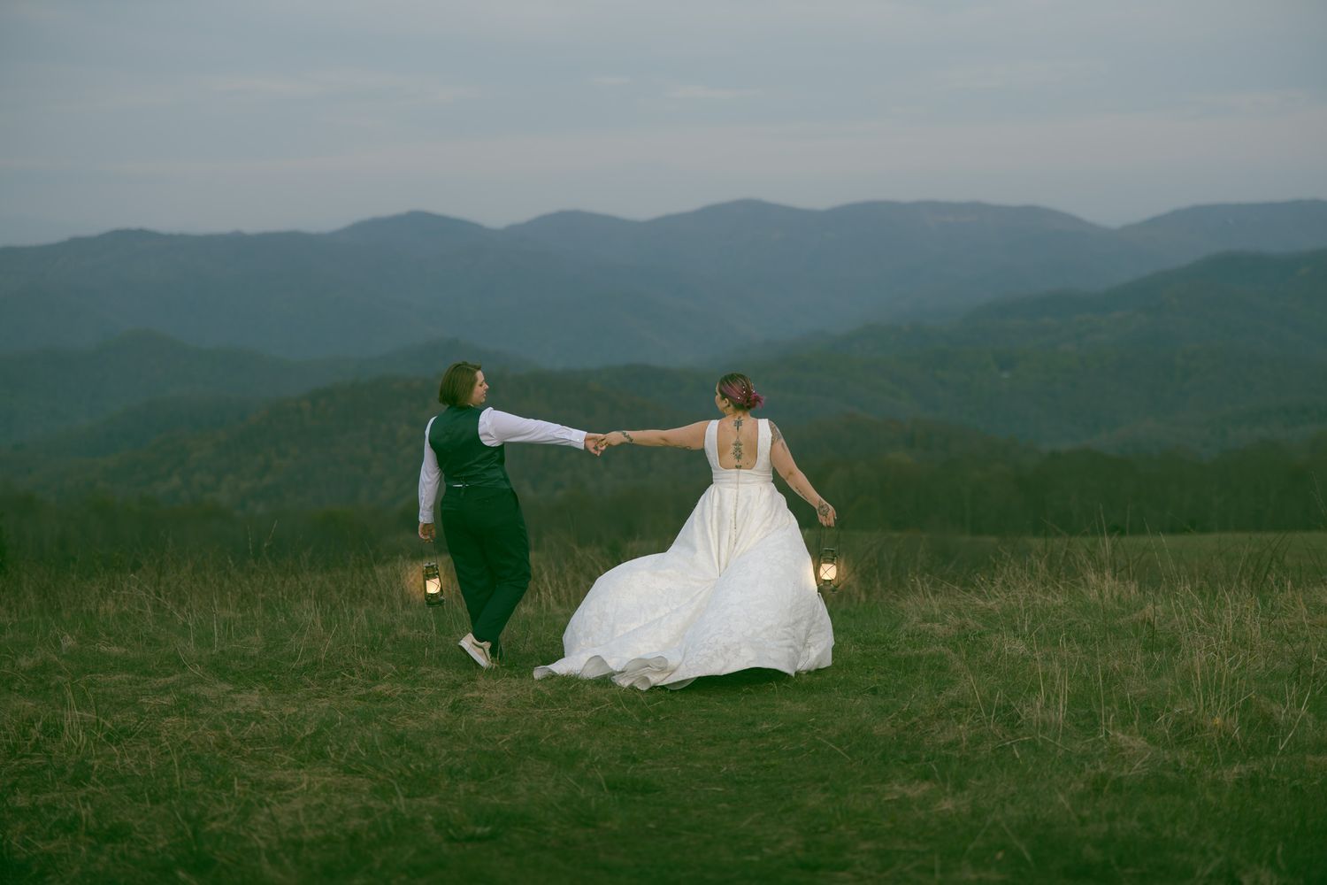 LGBTQ couple exploring during romantic elopement at blue ridge mountain overlook near Asheville, North Carolina