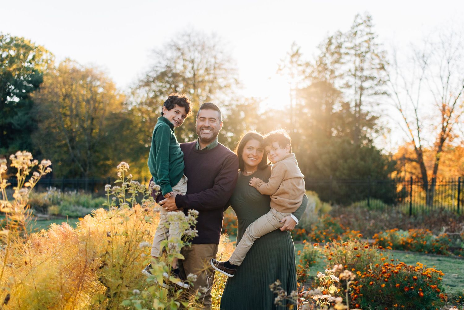 Family photos surrounded by fall foliage at Hartwood Acres in Pittsburgh