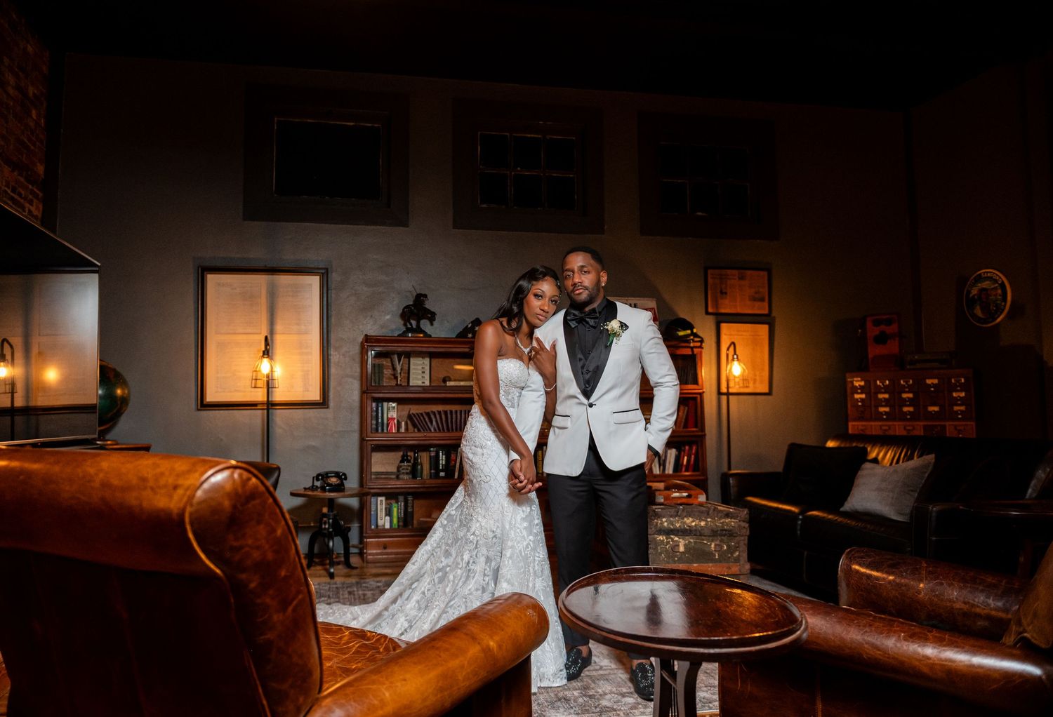 Wedding photographers in South Florida captured this elegant image of the bride & groom in the lounge at Venue 1902 luxury wedding venue.