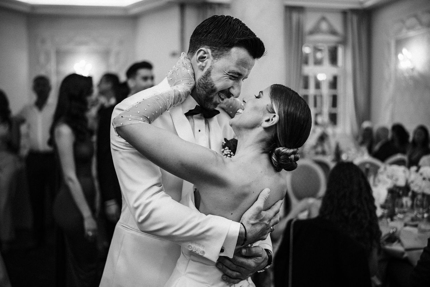 Black and white wedding photo montage showing intimate dance floor moments at an elegant reception celebration.