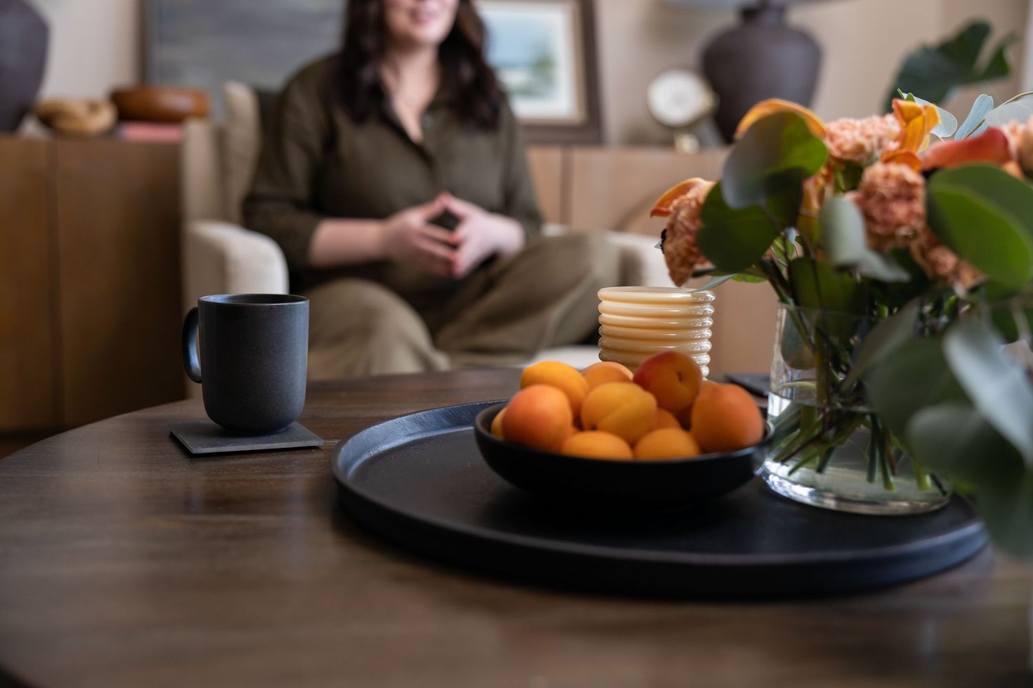 Woman business owner Talks Over Tea Mental Health Therapist in Tacoma, WA personal branding  sitting in office talking to client