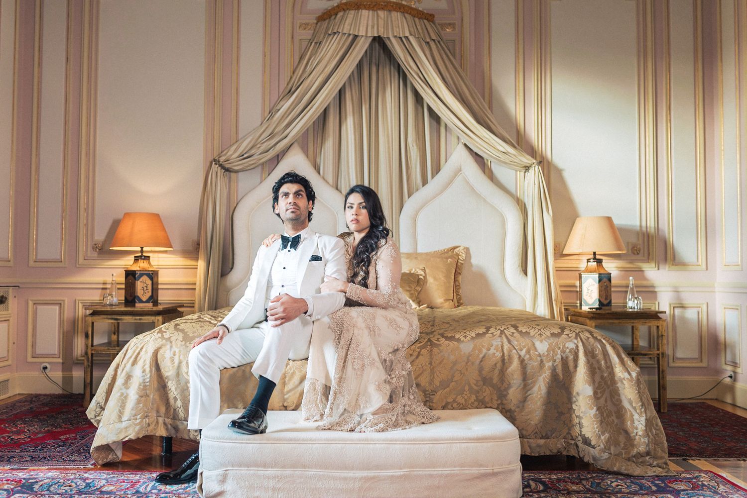 Romantic engagement photoshoot of a couple in an elegant attire pousing at Pestana palace in Lisbon during a Destination Wedding in Portugal