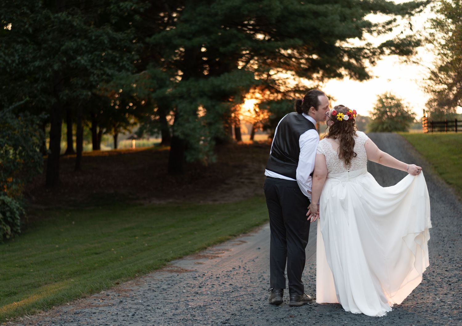 Bride and groom sharing a kiss at sunset at Wye Island during golden hour