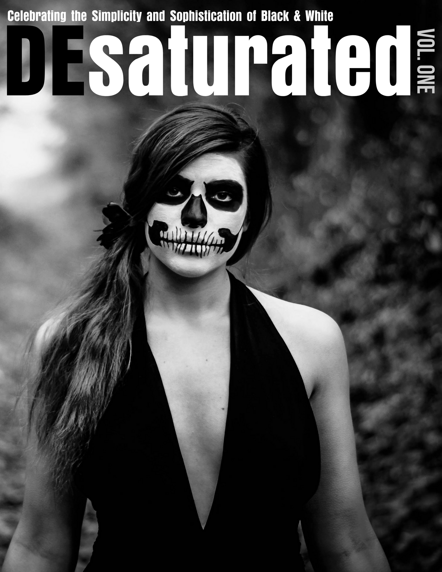 Black and white magazine cover featuring artistic skull makeup design.