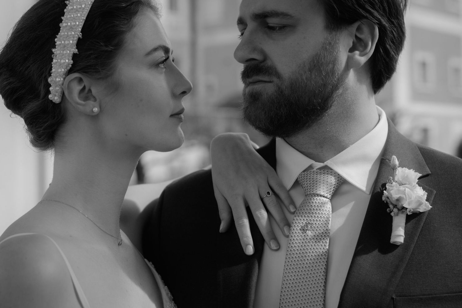A romantic black and white wedding photo sequence showing tender moments between a couple on their special day.