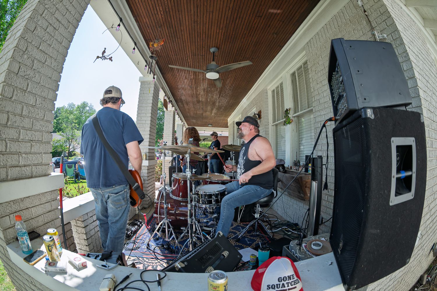 Chalk writing on sidewalk reading Porch Fest Rocks in colorful letters on gray concrete pavement.