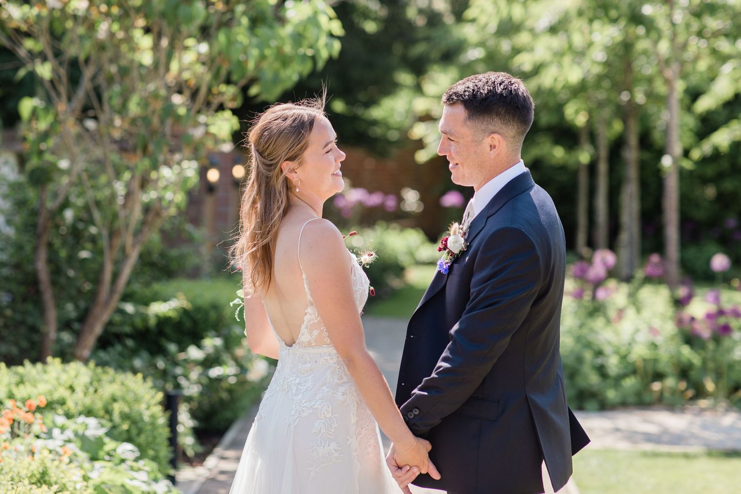 A romantic wedding photo series showing tender moments between a couple in Syrencot's walled garden by Maddie Waters Photography