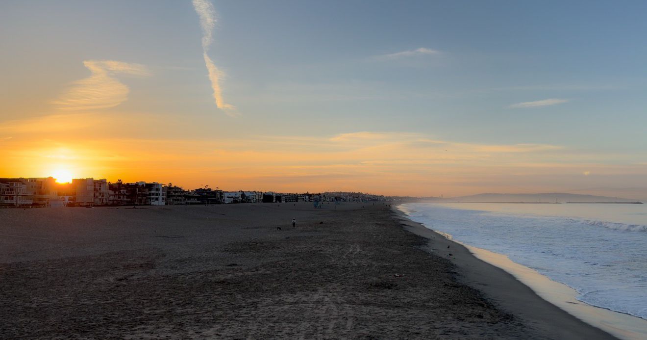 A series of five sunset beach scenes showing the progression of the sun dipping below the horizon over the ocean.