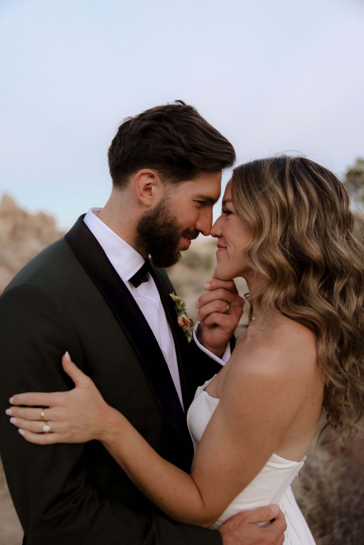 A romantic series of wedding photos showing intimate embraces and kisses between the newlyweds in formal attire.