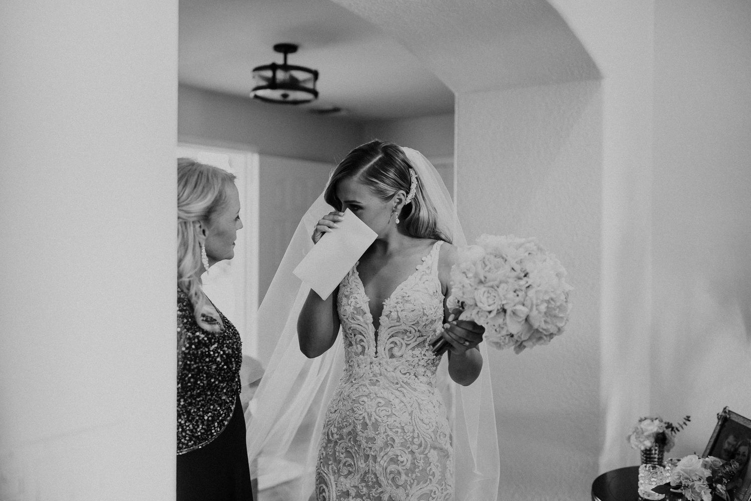 Black and white wedding preparation photos showing intimate getting ready moments and details.