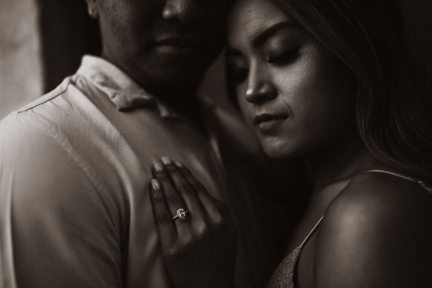 Atmospheric black and white portraits showing intimate moments between two people.