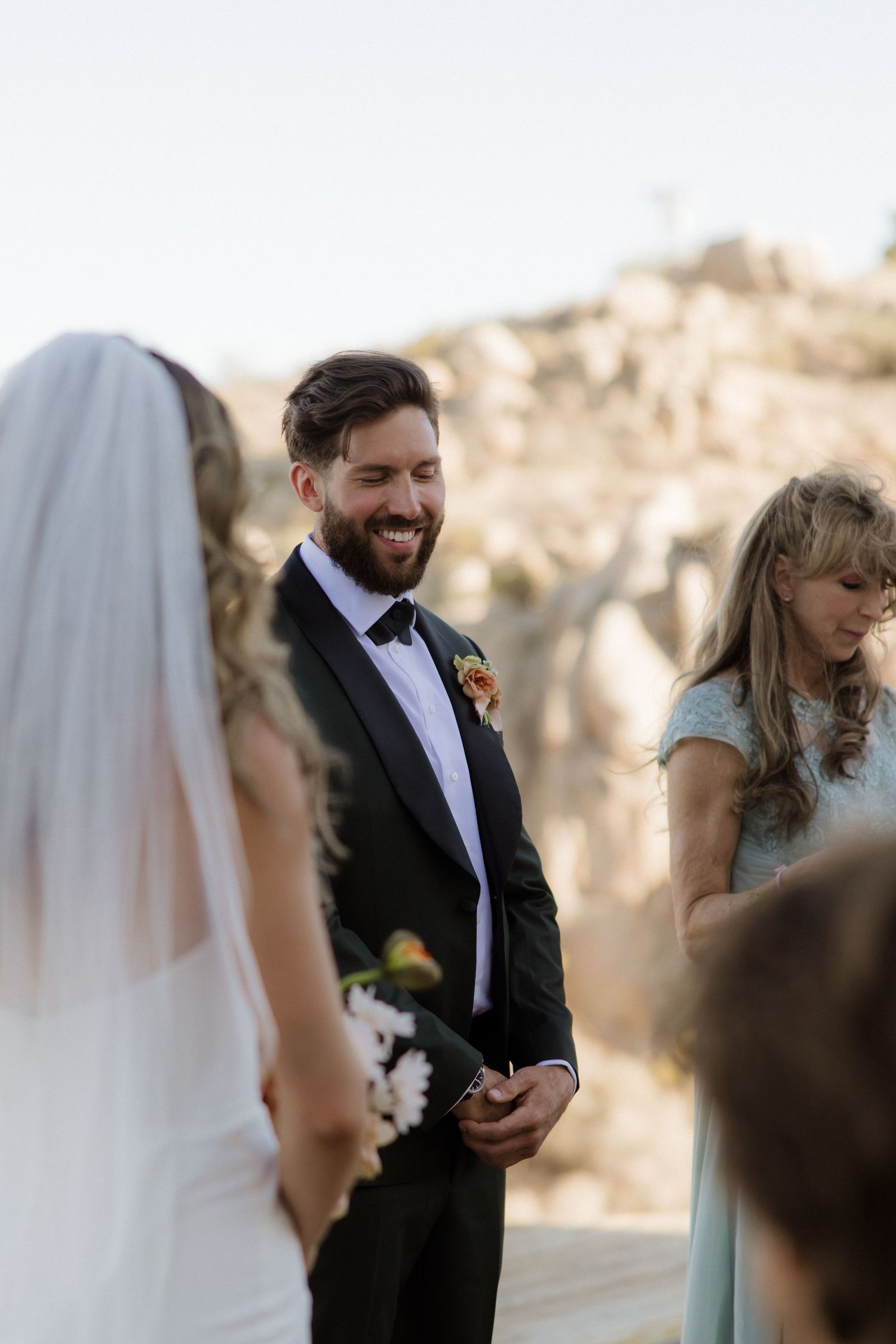 A heartfelt moment between a couple during an intimate outdoor wedding ceremony.
