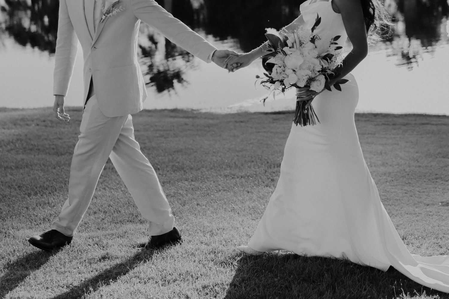 Aerial view of black and white photos showing couples dancing on a rustic outdoor dance floor.