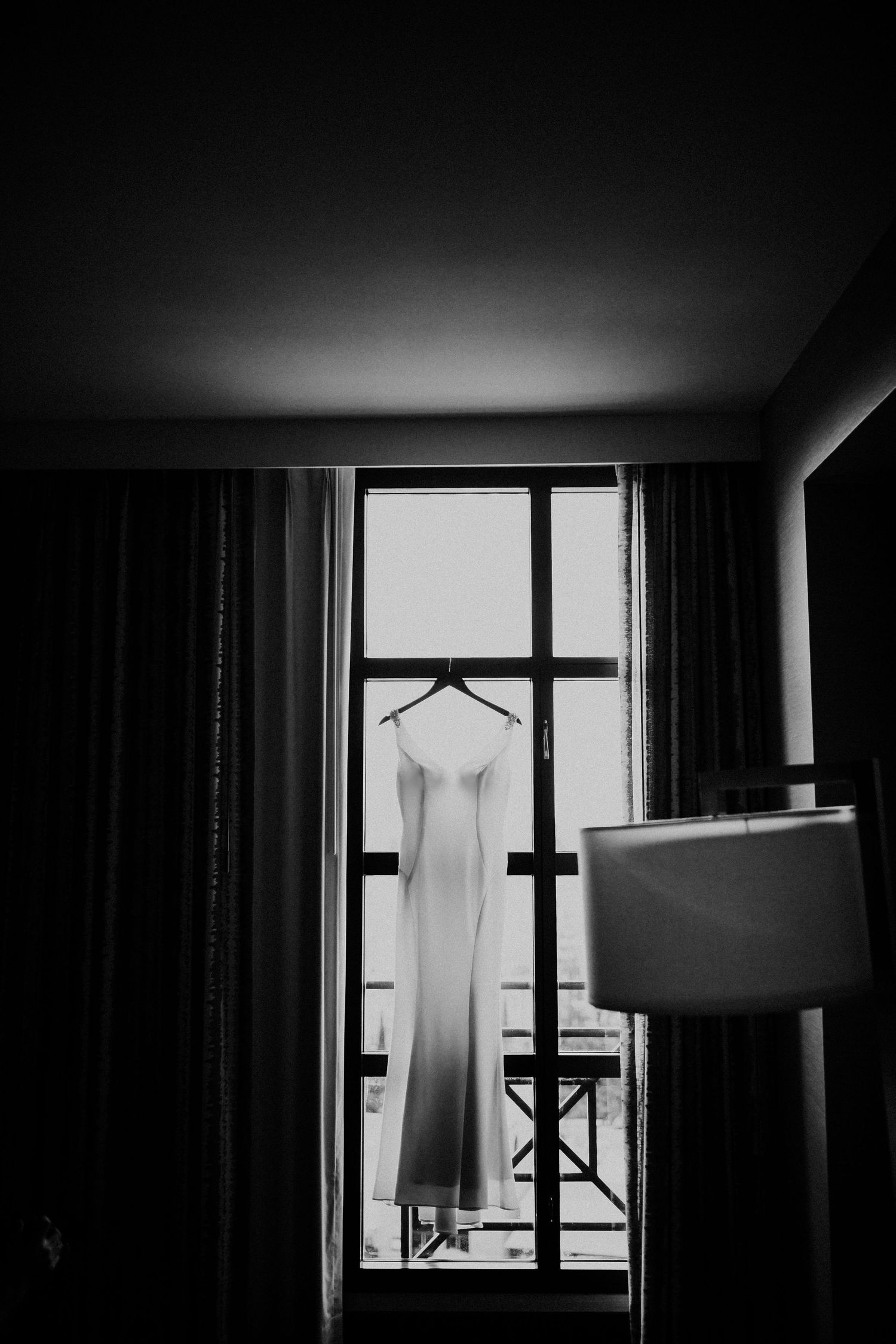 A dramatic black and white photo sequence showing increasingly darkening interior views of windows with curtains.