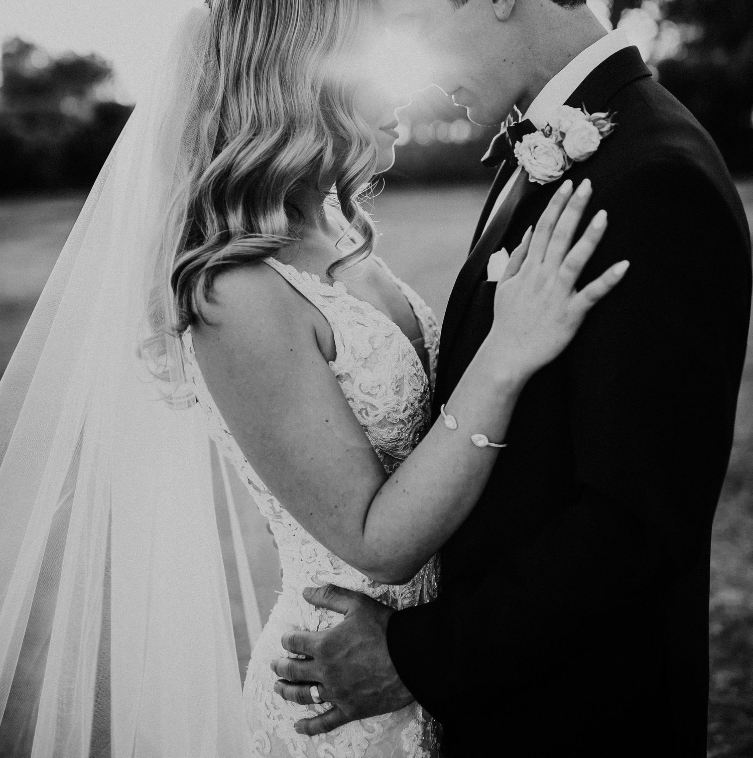 Romantic black and white wedding photos capturing tender moments between the newlywed couple.